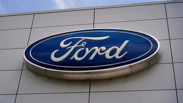 FILE - The Ford logo is displayed above the entrance to the Ford Motor Company Kentucky Truck Plant, Wednesday, April 30, 2025, in Louisville, Ky. (AP Photo/Carolyn Kaster, File)