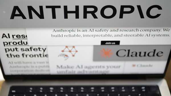 Pages from the Anthropic website and the company's logos are displayed on a computer screen in New York on Thursday, Feb. 26, 2026. (AP Photo/Patrick Sison)