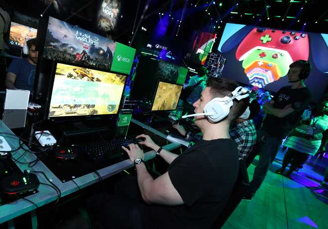 Gamers play "Halo Wars 2" at the Xbox Media Showcase at E3 2016, Monday, June 13, 2016, in Los Angeles. (Photo by Casey Rodgers/Invision for Microsoft/AP Images, File)