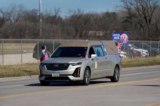A hearse caravans in a procession for Iowa National Guard members Maj. Jeffrey O&amp;apos;Brien, of Waukee, Iowa, and Sgt. Declan Coady, of West Des Moines, Iowa, who both died when a drone hit a command center in Port Shuaiba, Kuwait, during the Iran Israel U.S. war, in Des Moines, Iowa, Thursday, March 19, 2026. (AP Photo/Charlie Neibergall)
