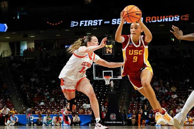 Southern California guard Jazzy Davidson, right, drives against Clemson guard Rachael Rose (14) during the first half of the first round of the NCAA college basketball tournament, Saturday, March 21, 2026, in Columbia, S.C.