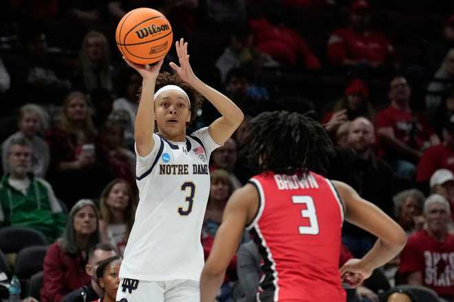 Notre Dame guard Hannah Hidalgo (3) shoots over Fairfield guard Janelle Brown (3) during the first half in the first round of the NCAA college basketball tournament, Saturday, March 21, 2026, in Columbus, Ohio. (AP Photo/Sue Ogrocki)