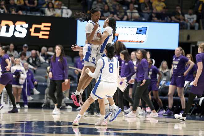 Kentucky players react in the first half against James Madison in the first round of the NCAA college basketball tournament, Saturday, March 21, 2026, in Morgantown, W.Va. (AP Photo/Kathleen Batten)