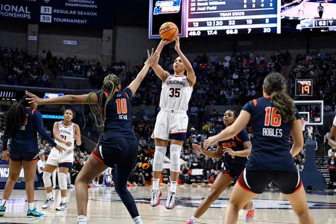 UConn guard Azzi Fudd (35) shoots over UTSA forward Sanaa Bean (10) during the second half in the first round of the NCAA college basketball tournament, Saturday, March 21, 2026, in Storrs, Conn. (AP Photo/Jessica Hill)