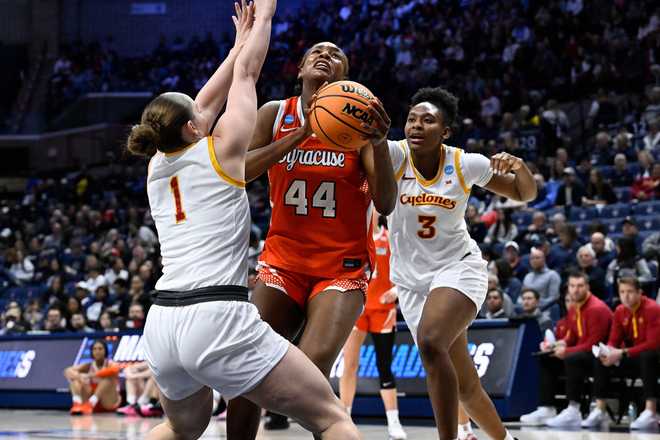 Syracuse center Uche Izoje (44) looks to shoot as Iowa State guard Reese Beaty (1) and forward Alisa Williams (3) defend during the first half in the first round of the NCAA college basketball tournament, Saturday, March 21, 2026, in Storrs, Conn. (AP Photo/Jessica Hill)