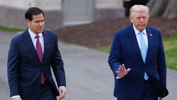 President Donald Trump walks with Secretary of State Marco Rubio to speak with reporters before departing on Marine One from the South Lawn of the White House, Friday, March 20, 2026, in Washington. (AP Photo/Julia Demaree Nikhinson)