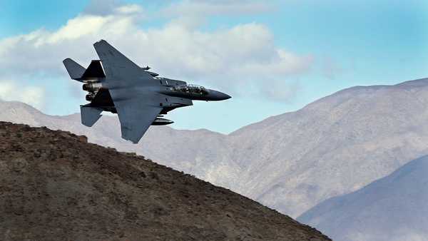 FILE - An F-15E Strike Eagle turns toward the Panamint range over Death Valley National Park, Calif., on Feb. 27, 2017. (AP Photo/Ben Margot, File)