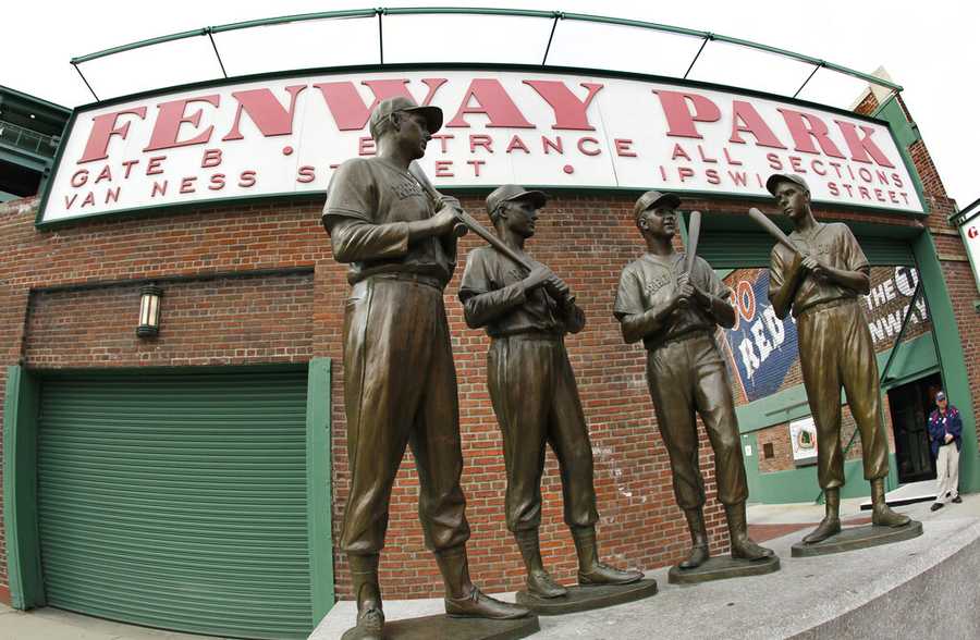 FILE - In this April 13, 2012 file photo, the "Teammates" statue of  Ted Williams, Johnny Pesky, Bobby Doerr and Dom DiMaggio circa 1946, appears at the entrance to Gate B at Fenway Park in Boston.