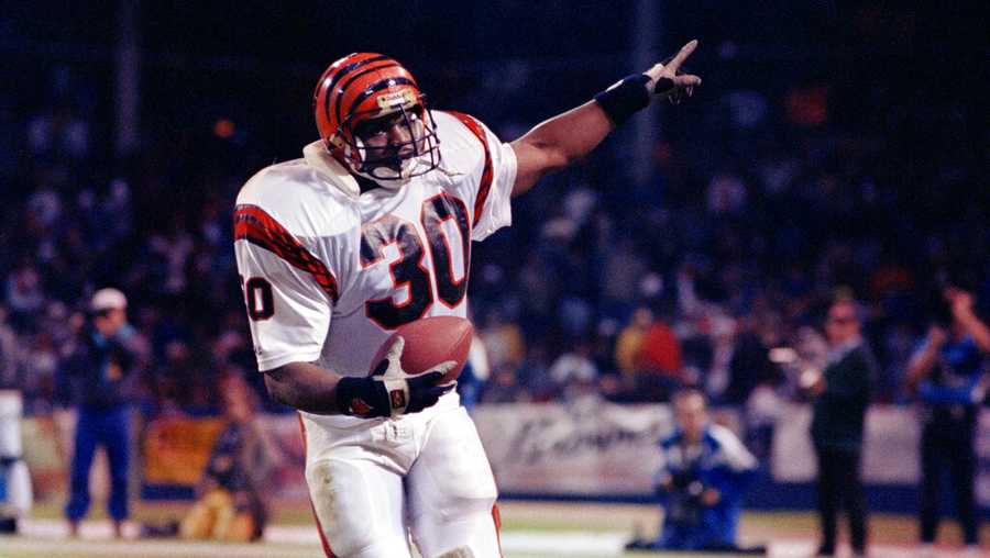 Running back Ickey Woods (30) of the Cincinnati Bengals finishes off his "Ickey Shuffle" after scoring a touchdown late in Monday night's game against the Cleveland Browns in Cleveland, Ohio, Oct. 23, 1990. The game was Wood's first since early last season when he went down with an injury. The Bengals defeated Browns 34-13. (AP Photo/Maribeth Joeright)