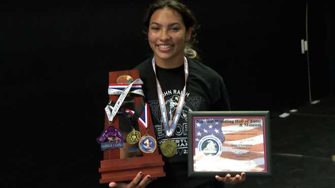 Gabriella Perez with her medals