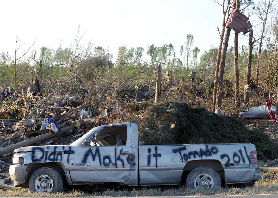 April 27 2011 Birmingham Tornado Alabama tornadoes A damaged truck is covered in graffiti in a tornado-ravaged area near Rainsville, Ala., Thursday, April, 28, 2011. A least 32 people died when a tornado struck Dekalb County Wednesday. (AP Photo/ Birmingham News, Mark Almond) ** MAGS OUT NO SALES **