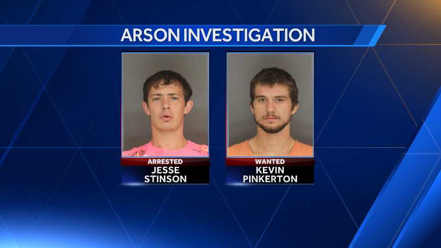 One person arrested, another wanted on arson charges