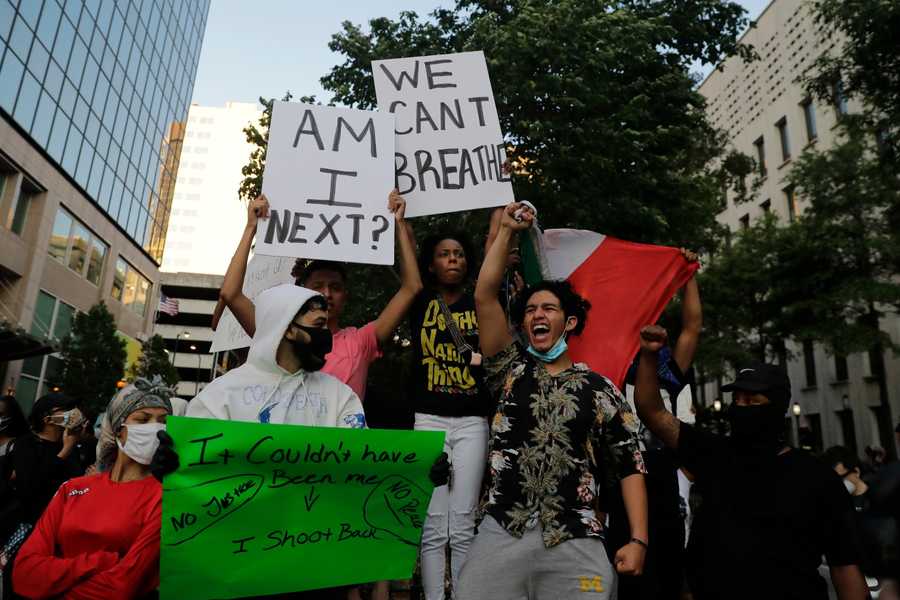 Demonstrators march, Sunday, May 31, 2020, in Atlanta.