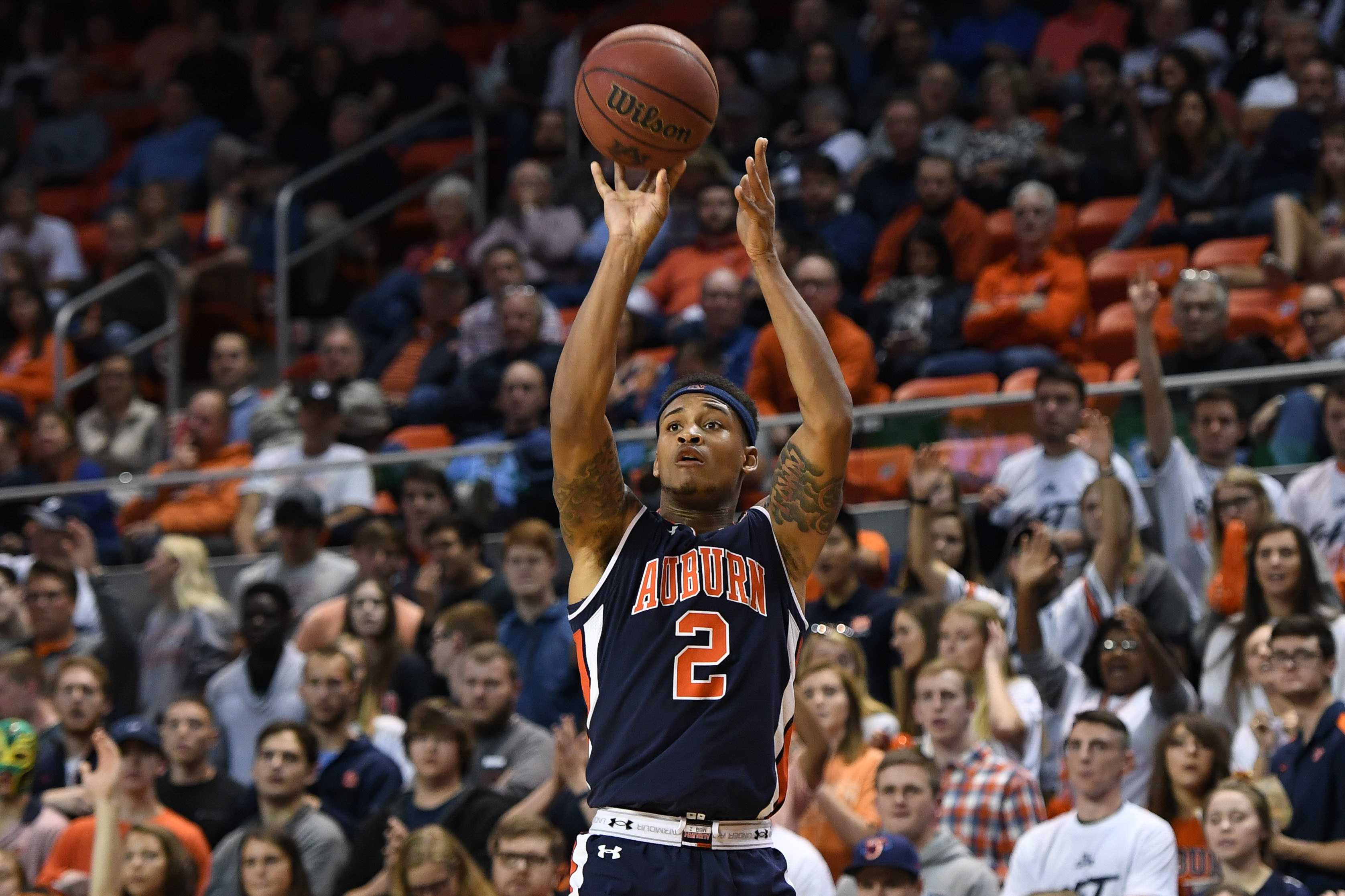 SEATTLE WA  DECEMBER 21 Auburn Tigers guard Tre Donaldson 3 dunks the  ball during a college basketball game between the Auburn Tigers and the  Washington Huskies on December 21 2022 at