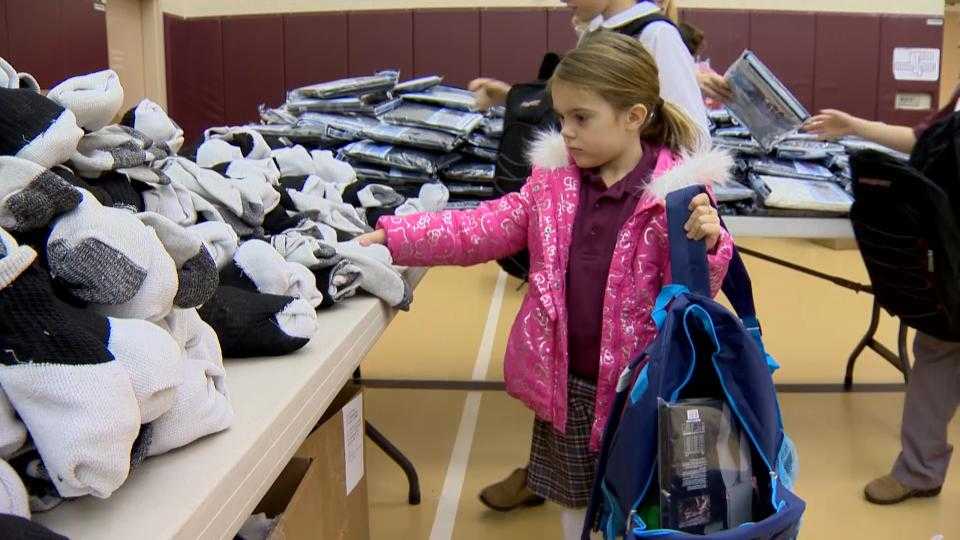 Students assemble backpacks to help homeless get through winter