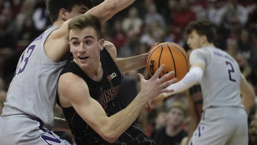 wisconsin's tyler wahl tries to get past northwestern's brooks barnhizer during the second half of an ncaa college basketball game sunday, feb. 5, 2023, in madison, wis. (ap photo/morry gash)