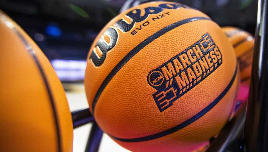 A basketball with a March Madness logo rests on a rack before the NCAA women's basketball tournament Wednesday, March 15, 2023, in South Bend, Ind.