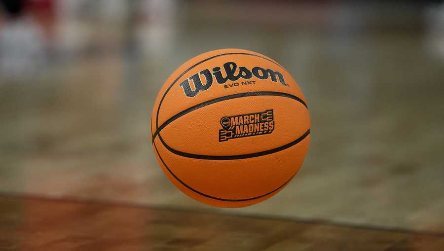 A ball bounces across the court during a practice session for the first-round college basketball games of the NCAA Tournament.