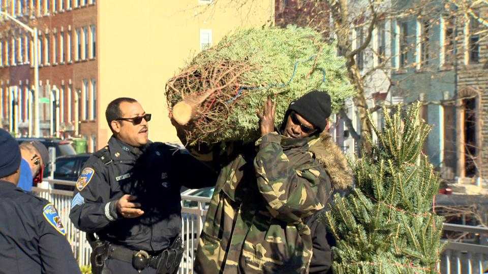 Baltimore police give away Christmas trees