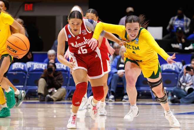 Nebraska's Kennadi Williams (15) and Baylor's Jana Van Gytenbeek (4) chase a loose ball during the first half in the first round of the NCAA college basketball tournament, Friday, March 20, 2026, Durham, N.C.