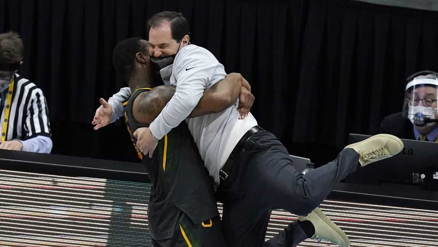 Baylor head coach Scott Drew gets a hug from guard Mark Vital at the end of the championship game against Gonzaga in the men's Final Four NCAA college basketball tournament, Monday, April 5, 2021, at Lucas Oil Stadium in Indianapolis. Baylor won 86-70.