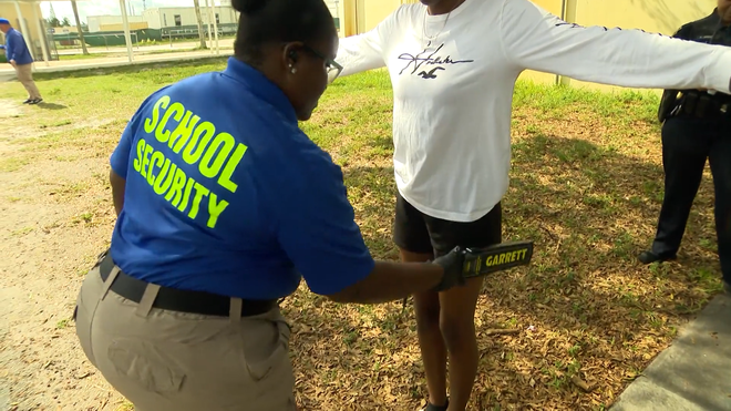 in&#x20;this&#x20;district-provided&#x20;video,&#x20;students&#x20;at&#x20;an&#x20;unidentified&#x20;campus&#x20;in&#x20;broward&#x20;county&#x20;public&#x20;schools&#x20;are&#x20;searched&#x20;for&#x20;prohibited&#x20;items&#x20;by&#x20;hand-wand&#x20;devices&#x20;on&#x20;nov.&#x20;2,&#x20;2022&#x3B;&#x20;courtesy&#x3A;&#x20;bcps