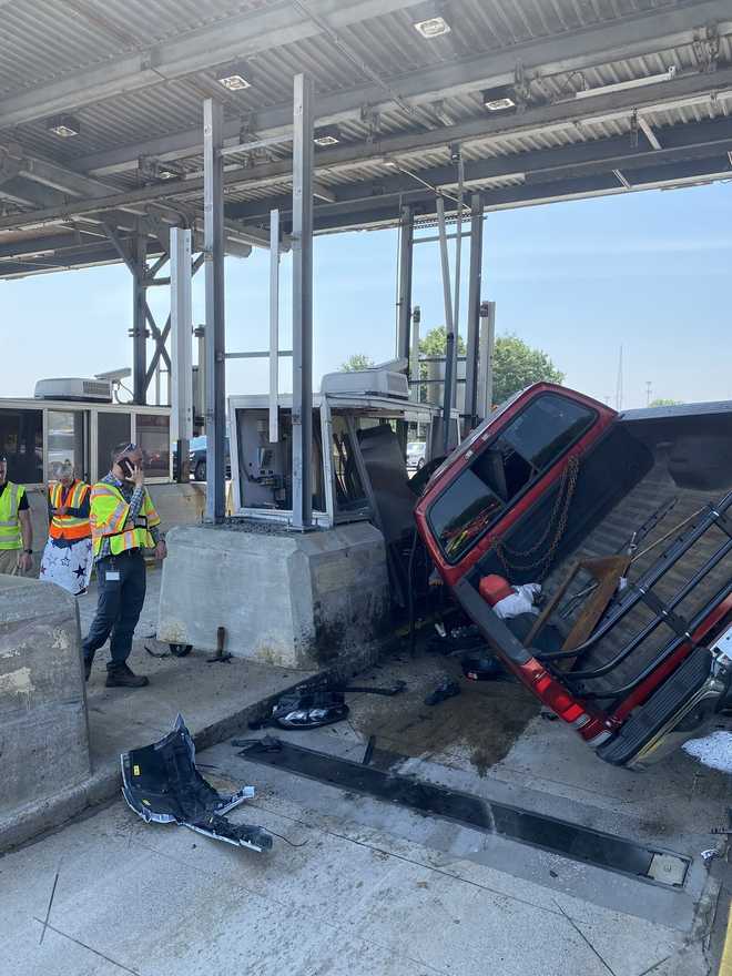 Truck on top of SUV after crash at New Hampshire toll plaza