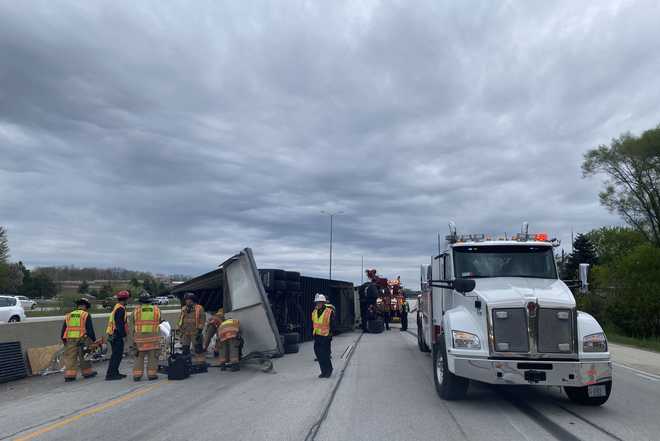 Beer truck overturns on interstate in Menomonee Falls