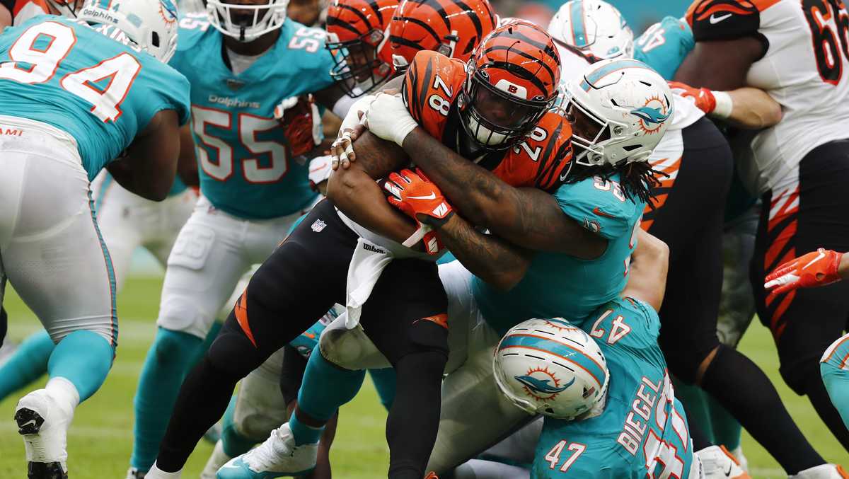 Andy Dalton of the Cincinnati Bengals attempts to break a tackle