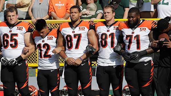 Bengals lock arms during national anthem, say 'football, politics