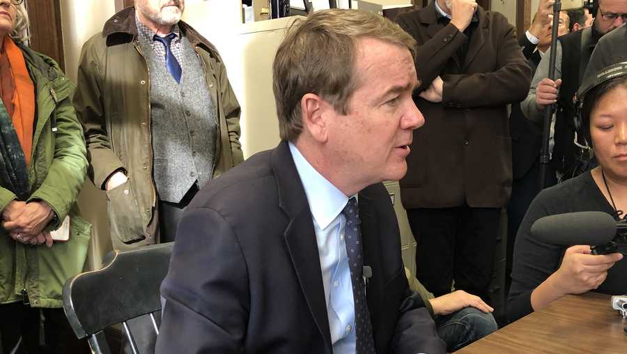Sen. Michael Bennet speaks to reporters after filing his candidacy in the NH primary.