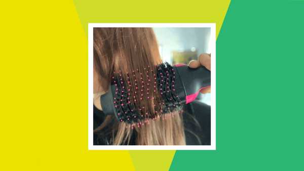 woman using revlon hot brush to dry hair