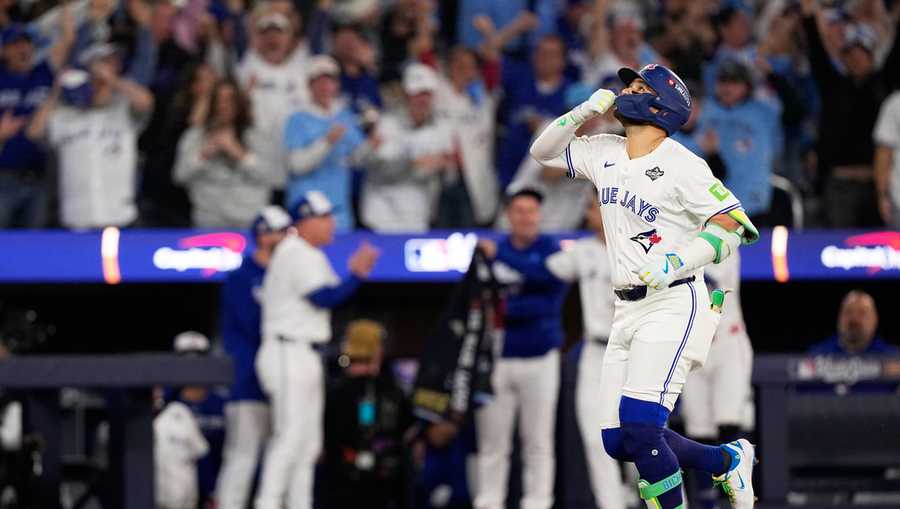 Toronto Blue Jays&apos; Bo Bichette celebrates his three run home run against the Los Angeles Dodgers during the third inning in Game 7 of baseball&apos;s World Series, Saturday, Nov. 1, 2025, in Toronto.