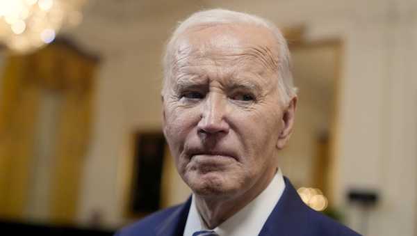 President Joe Biden speaks with reporters after signing the Social Security Fairness Act in the East Room of the White House.