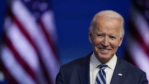 In this Nov. 10, 2020, file photo President-elect Joe Biden smiles as he speaks at The Queen theater in Wilmington, Del.