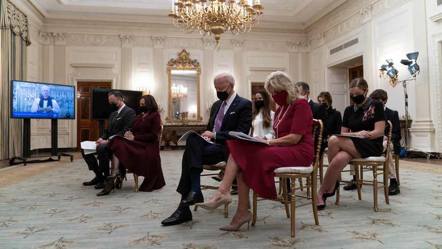 Doug Emhoff, left, Vice President Kamala Harris, President Joe Biden, and first lady Jill Biden, bow their heads in prayer during a virtual Presidential Inaugural Prayer Service, in the State Dinning Room of the White House, Thursday, Jan. 21, 2021, in Washington.