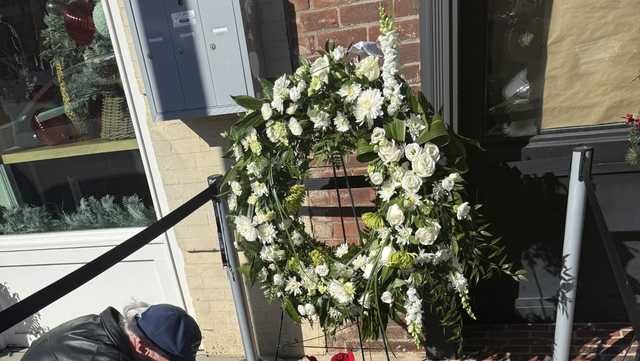 Race fans honor Greg Biffle at makeshift memorial in downtown Mooresville