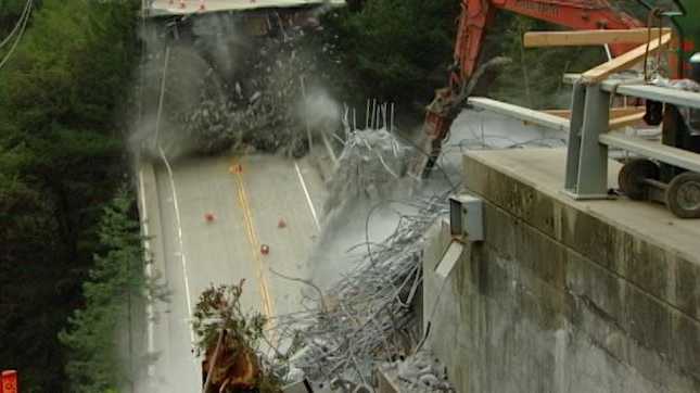 The Pfeiffer Bridge was demolished Friday afternoon after days of using a crane to break the foundation.
