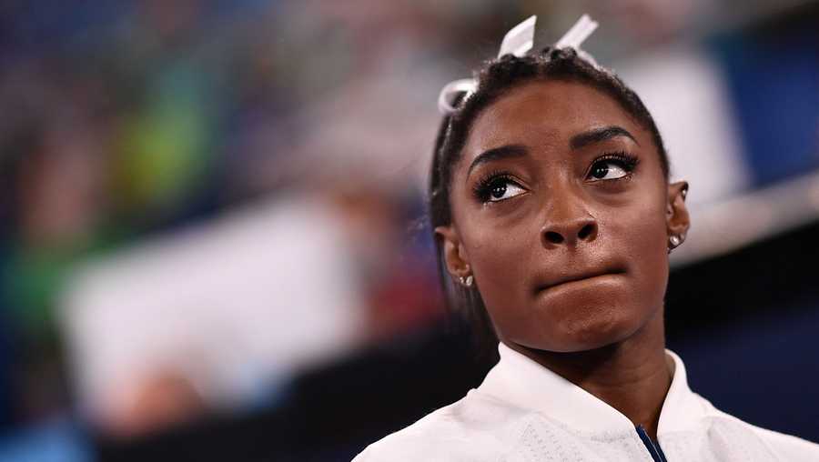 USA's Simone Biles reacts during the artistic gymnastics women's team final during the Tokyo 2020 Olympic Games at the Ariake Gymnastics Centre in Tokyo on July 27, 2021.