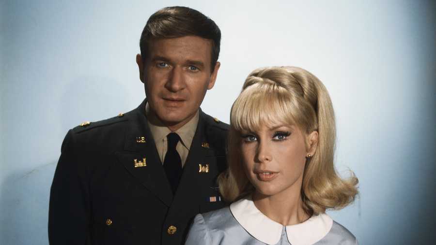In this file image, actors Bill Daily and Barbara Eden, from "I Dream of Jeannie," pose for a photo.