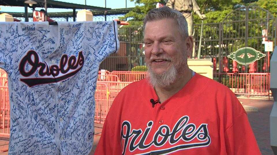 Orioles fan shows 218 autographs on jersey