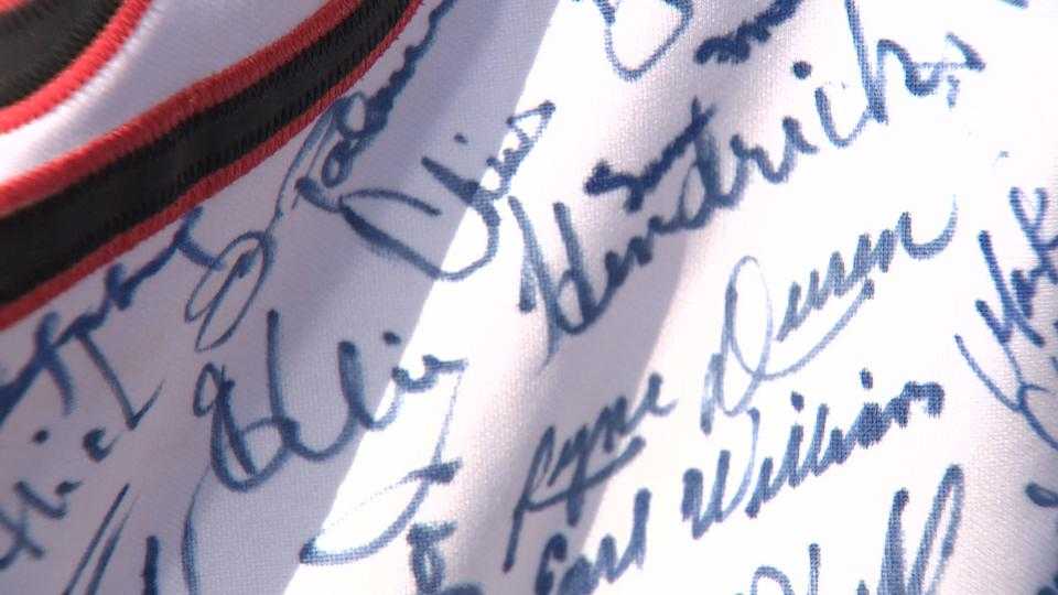 Orioles fan shows 218 autographs on jersey