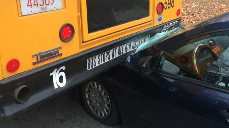 Car slams into rear of school bus