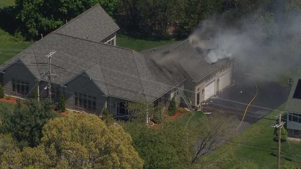 Crews battle smoky house fire in Billerica