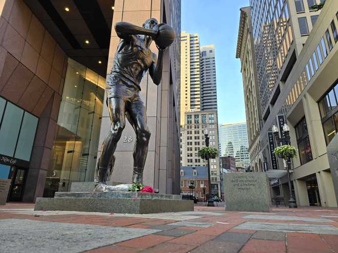 Flowers laid at base of Bill Russell statue in Boston after Celtics win ...