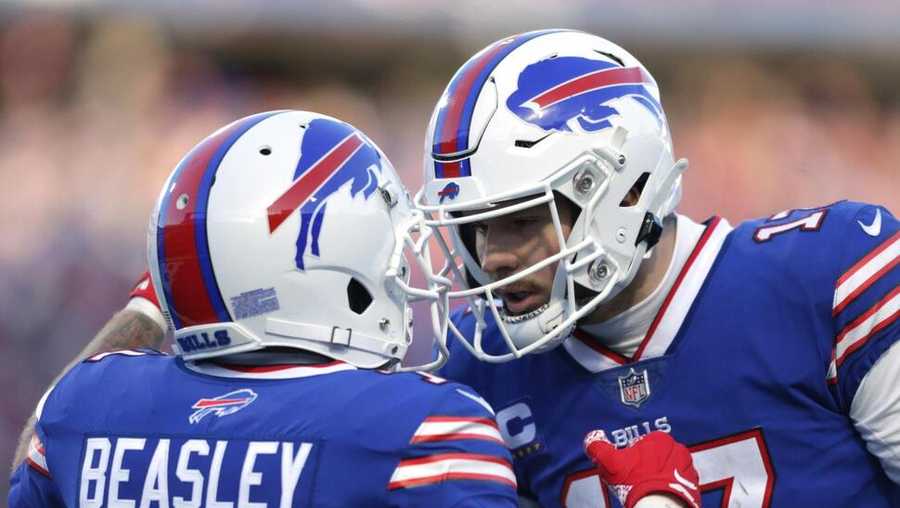 buffalo bills wide receiver cole beasley (11), left, is congratulated by quarterback josh allen after his touchdown catch during the second half of an nfl wild-card playoff football game against the miami dolphins, sunday, jan. 15, 2023, in orchard park, n.y. (ap photo/joshua bessex)