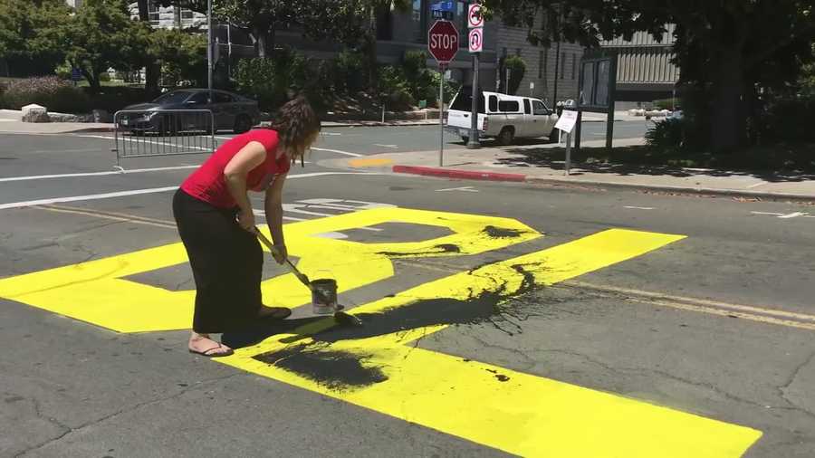 A white man and a white woman who allegedly painted over a California community's Black Lives Matter mural this weekend are each facing a hate crime charge, the Contra Costa County District Attorney's Office said.
