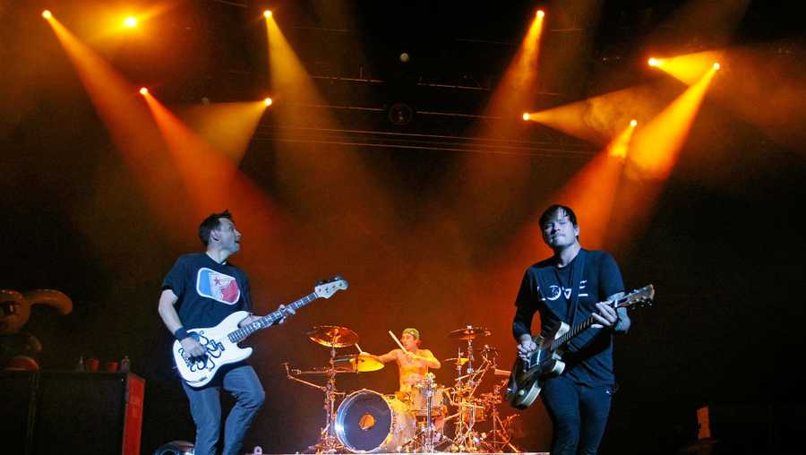 Blink-182 singer/bassist Mark Hoppus, drummer Travis Barker and singer/guitarist Tom DeLonge perform during the first show of the band's reunion tour at The Joint inside the Hard Rock Hotel & Casino July 23, 2009 in Las Vegas, Nevada.