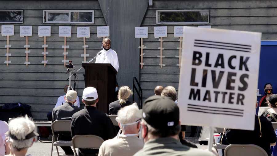Deacon Joseph Conner speaks at an outdoor prayer vigil for racial justice at Immaculate Conception Catholic Church Sunday, July 19, 2020, in Seattle. The vigil follows ongoing protests over the death of George Floyd, a Black man who died in police custody in Minneapolis. (AP Photo/Elaine Thompson)