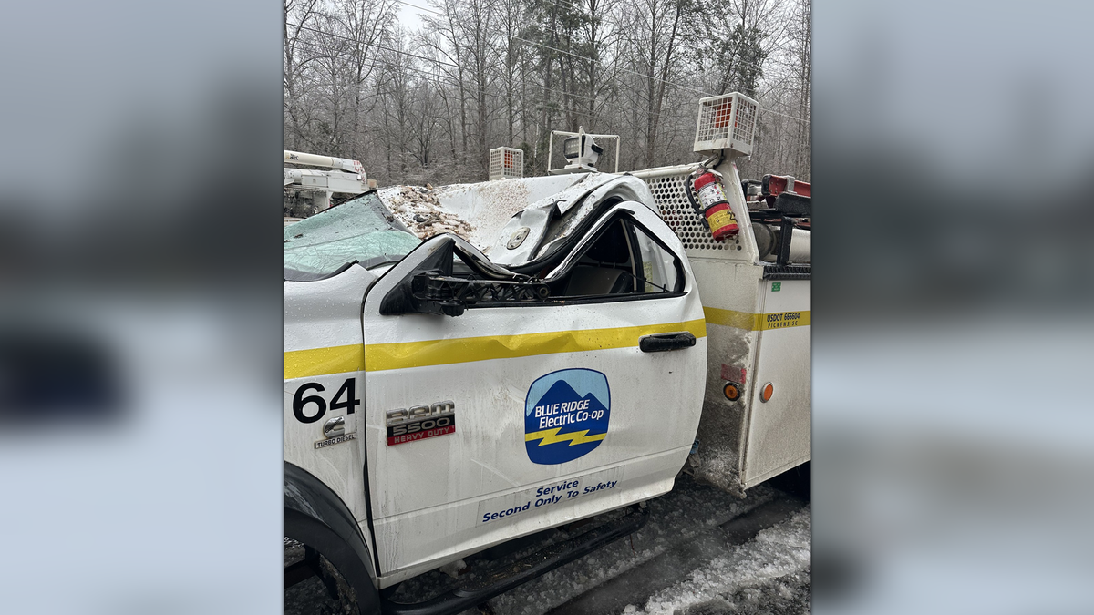 Two linemen escape unharmed after tree falls on truck during ice storm